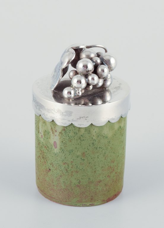 Arne Bang/Aage Weimar, lidded jar. Ceramic jar with green-toned glaze, sterling silver lid. Adorned with a cluster of grapes.