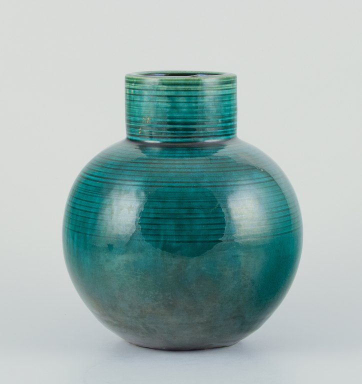 European studio ceramicist. Large ceramic vase in a modernist style with green glaze.