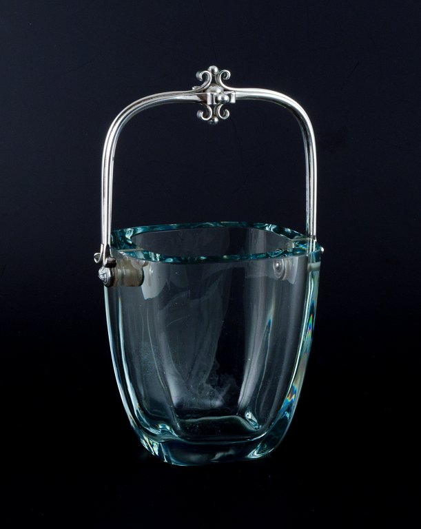 E. Dragsted, Danish silversmith.Danish design. Modernist ice bucket in art glass with a sterling silver handle. Sleek Danish design.