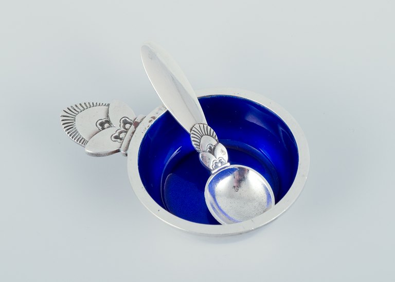 Georg Jensen Cactus. Salt cellar in sterling silver with accompanying salt spoon. Interior with royal blue enamel.