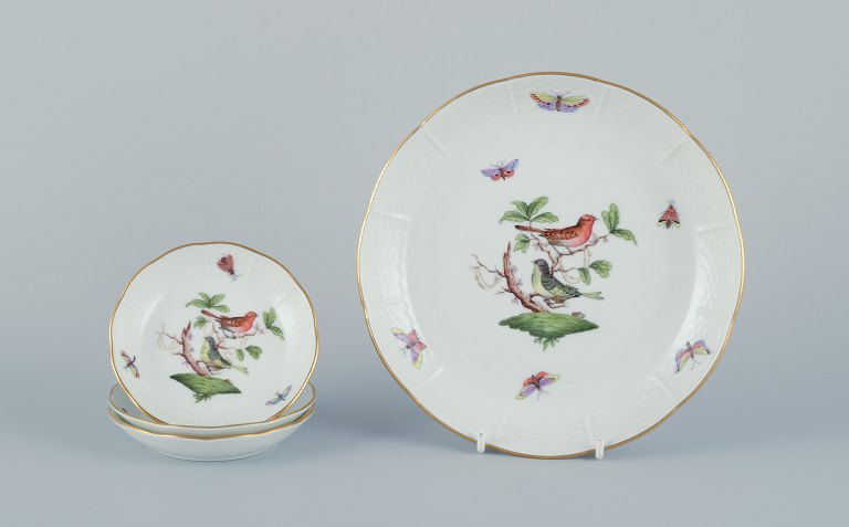 Herend, Hungary. Set of four porcelain bowls hand-painted with butterflies and birds on branches. Gold rim.