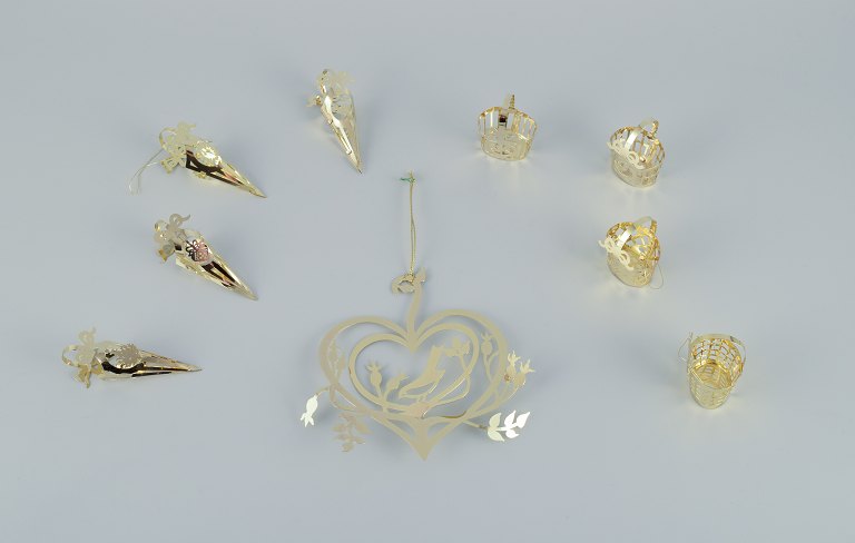 Royal Copenhagen "Royal Christmas". Set of nine brass Christmas ornaments for hanging on the Christmas tree and in the window.