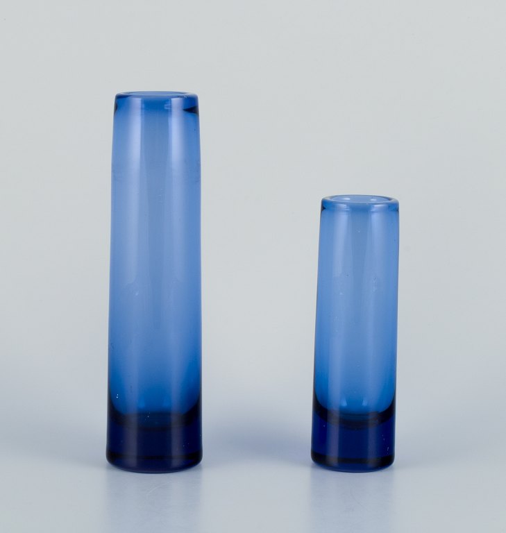 Per Lütken for Holmegaard, Denmark.Two cylindrical art glass vases in blue glass.