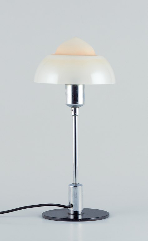 Fog & Mørup. Table lamp with a chrome stem, fitted with a "Spejlæg"(Fried Egg) glass shade.