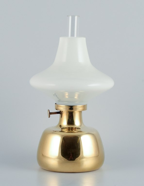Henning Koppel for Louis Poulsen. Petronella oil lamp in brass with an opal glass shade.