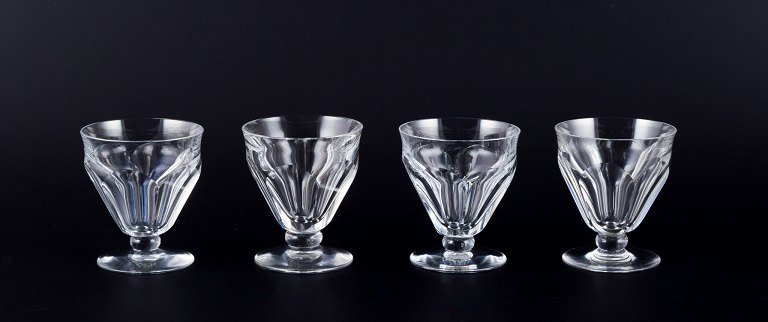 Baccarat, France. A set of four Art Deco white wine glasses in faceted cut crystal glass.