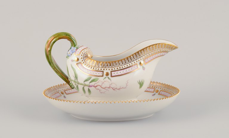 Royal Copenhagen Flora Danica sauce boat on a pedestal with a leaf-shaped handle.