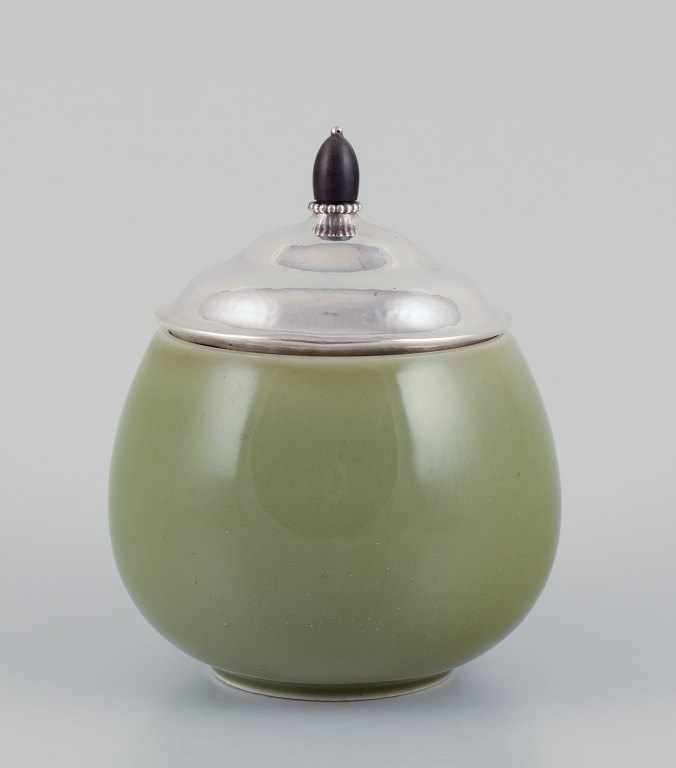 Royal Copenhagen ceramic jar. Silver lid with an ebony knob.Celadon glaze.