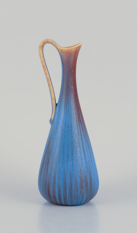 Gunnar Nylund for Rörstrand. Ceramic pitcher with a glaze in blue and brown tones.