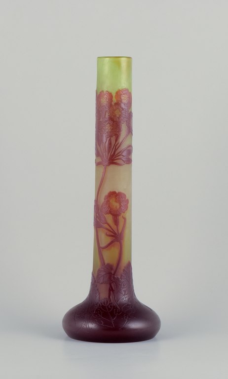 Émile Gallé (1846-1904), France. Colossal art glass vase with floral motifs in shades of purple on a green base. Pâte de verre technique.