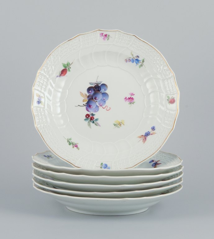Meissen, Germany. A set of six antique deep porcelain dinner plates. Hand-painted with polychrome fruit motifs.