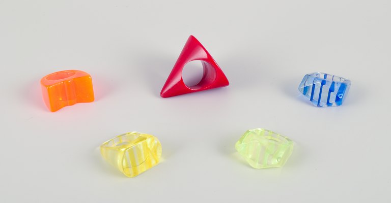 French jewelry artist. Five designer rings in plastic. Striped design with various colors.