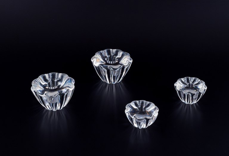 Sven Palmqvist for Orrefors, Sweden. Four art glass candleholders in crystal glass, two different sizes.