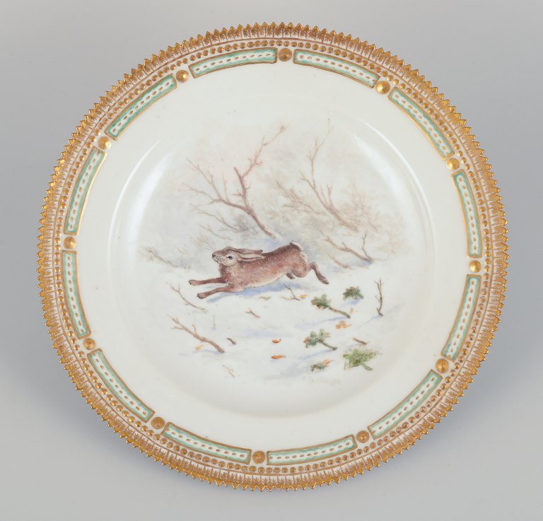 Royal Copenhagen Fauna Danica dinner plate with a motif of a hare in a winter landscape. Hand-painted.