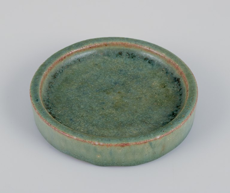 Arne Bang, own workshop. Small ceramic dish decorated in blue-green glaze. Handmade.