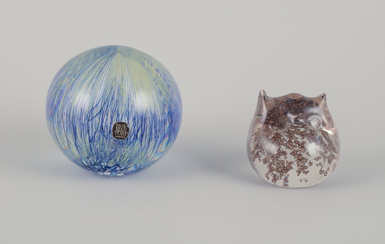E. Söderberg for Hovmantorp, Swedish glass artist, and Muurla, Finland. Two sculptures in art glass. An owl and a spherical sculpture with an abstract motif.