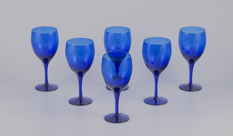 Monica Bratt for Reijmyre, Swedish glassworks. A set of six red wine glasses in blue art glass. Handmade.