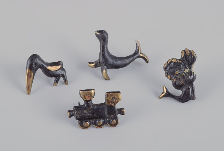 Walter Bosse (1904-1979), Austria.Four miniature bronze figurines. Train, mermaid, toucan, and seal.