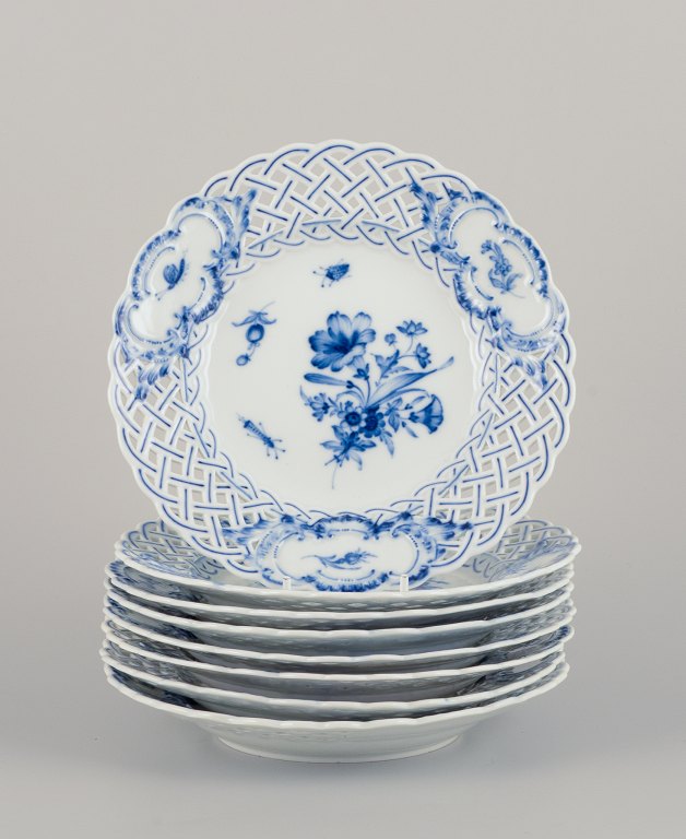 Meissen, Germany. A set of eight open lace Blue Onion plates, adorned with hand-painted flower motifs and insects.