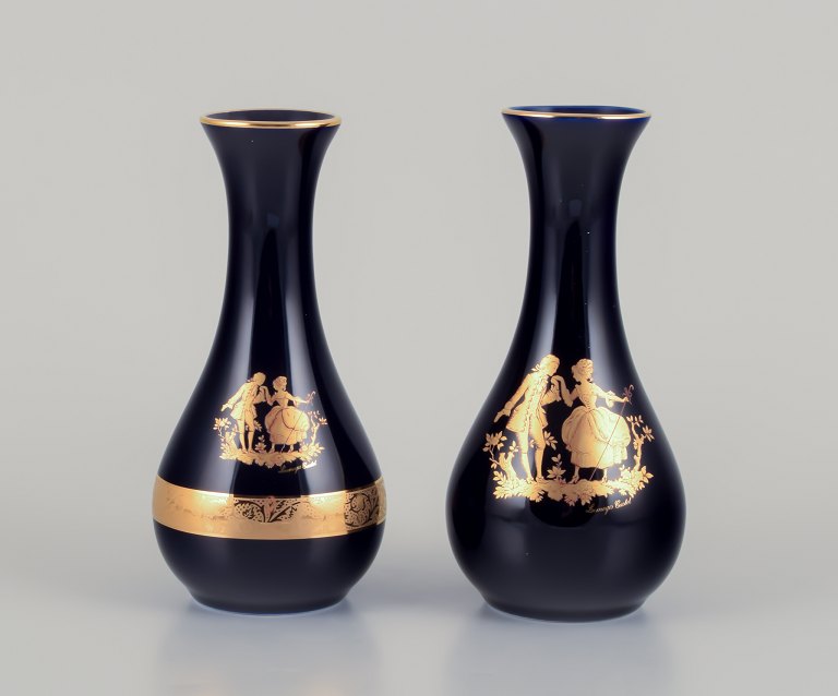 Limoges, France. Two porcelain vases decorated with 22-karat gold leaf and beautiful royal blue glaze. Scène galante.