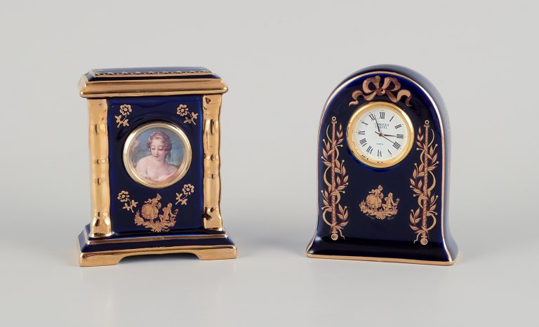 Limoges, France. Clock and decorative object in porcelain, decorated with 22-karat gold leaf and a beautiful royal blue glaze. Scène galante.