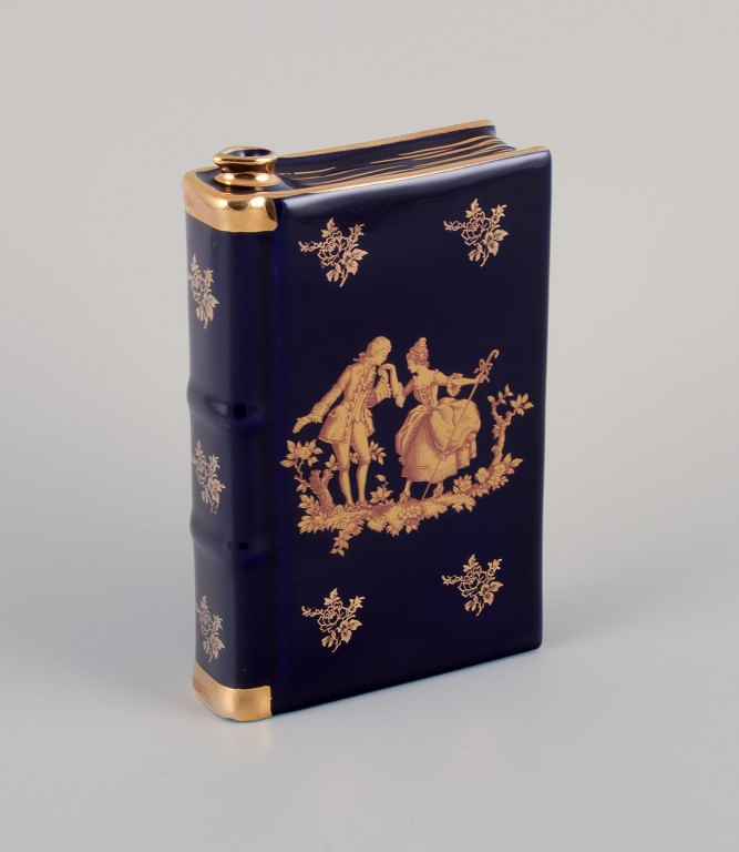Limoges, France. Porcelain "hip flask" shaped like a book decorated with 22-karat gold leaf and beautiful royal blue glaze. Scène galante.