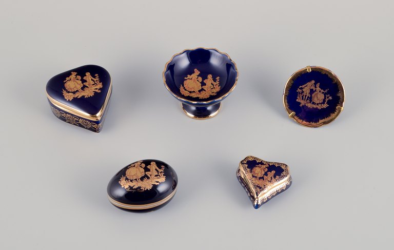 Limoges, France. Five pieces of miniature porcelain decorated with 22-karat gold leaf and beautiful royal blue glaze.