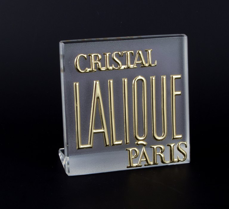 René Lalique, France. Exhibition sign/store sign in partially frosted glass. Gold lettering.