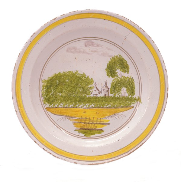 Sjælden Gudumlund tallerken med polykrom dekoreret landskabsmotiv. Stemplet. Afbildet i Ulldall: "Gammel Dansk fajance", P. 125. D: 23cm