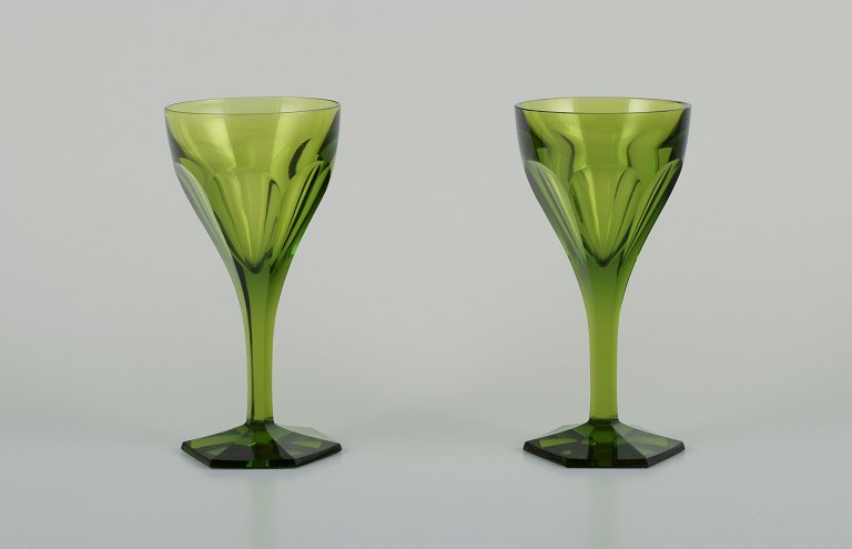 Baccarat, France. Two Tallyrand green white wine glasses in faceted crystal glass.