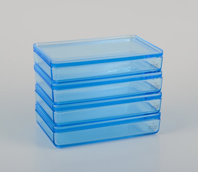 Rauff & Møldrup for Holmegaard. Set of four Thurø storage boxes in turquoise blue art glass.