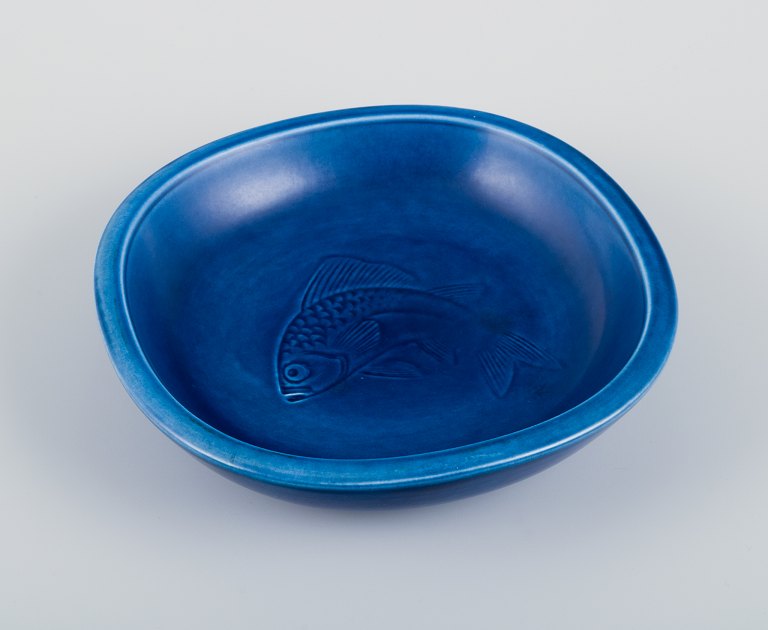Nils Thorsson for Aluminia. Faience bowl with blue glazed finish. Featuring a fish motif.