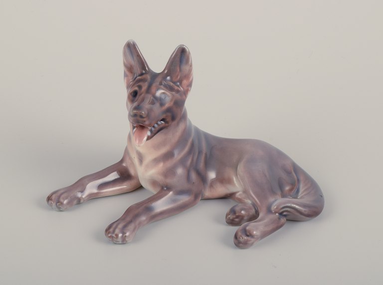 Dahl Jensen, porcelain figurine of a reclining German Shepherd.