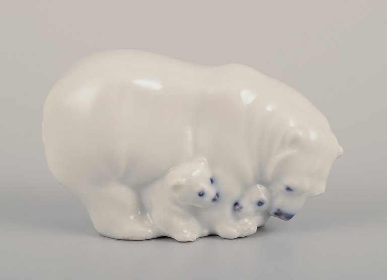 Royal Copenhagen, rare porcelain figurine of a polar bear mother with three cubs.