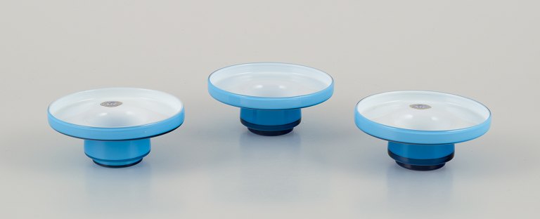 Michael Bang for Holmegaard. Three "Palet" candle holders in turquoise mouth-blown art glass.