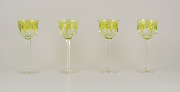 Moser, Czech Republic.A set of four tall white wine glasses in clear and green glass.