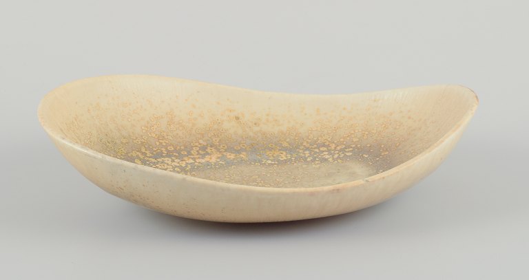 Carl Harry Stålhane for Rörstrand.Large bowl with crystal glaze in light tones.