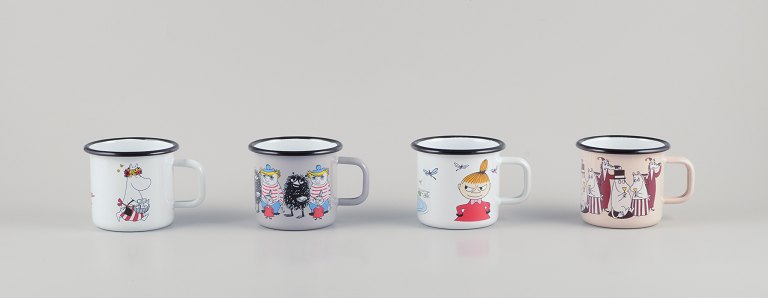 Muurla, Finland. Four enamel mugs with different motifs from the Moomin troll universe.