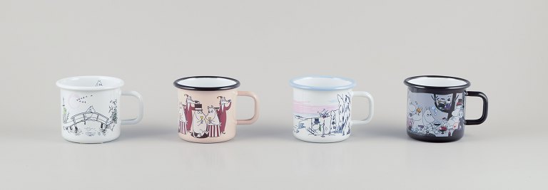 Muurla, Finland. Four enamel mugs with different motifs from the Moomin troll universe.