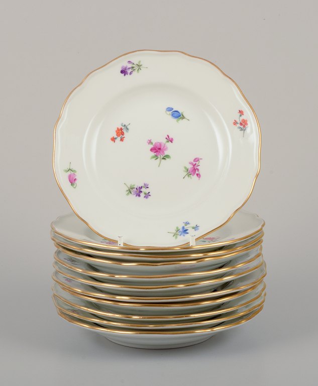 Meissen, Germany.A set of eleven small plates in porcelain.