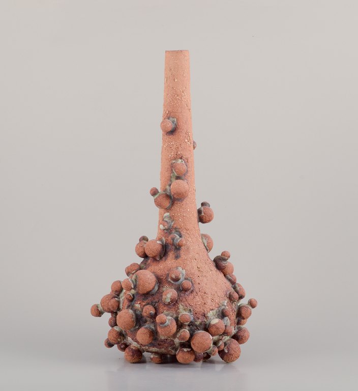 Christina Muff, Contemporary Danish ceramic artist (born 1971).Very tall vessel covered in clay balls.
