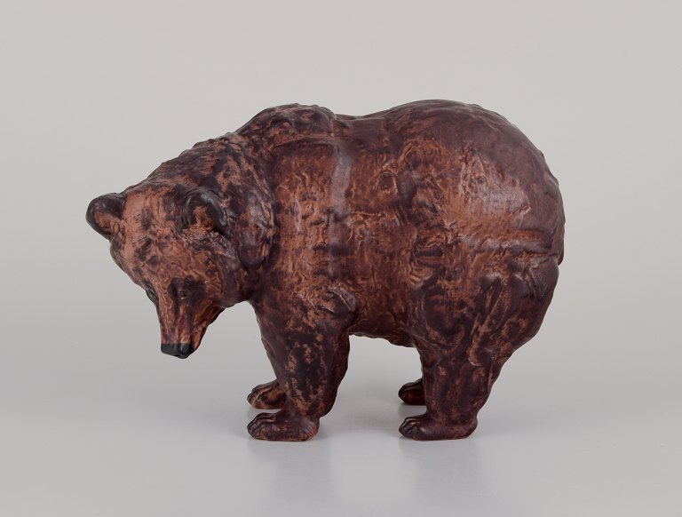 Jeanne Grut for Royal Copenhagen Aluminia faience.Large figurine of standing brown bear.