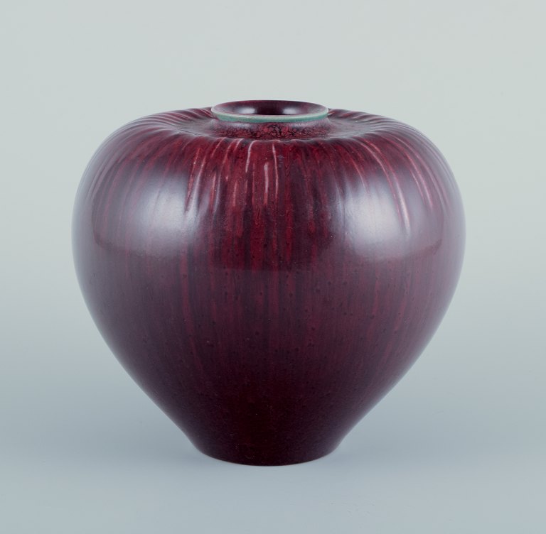 Gerd Bøgelund, Danish ceramist, for Royal Copenhagen.Ceramic vase in ox-blood glaze.