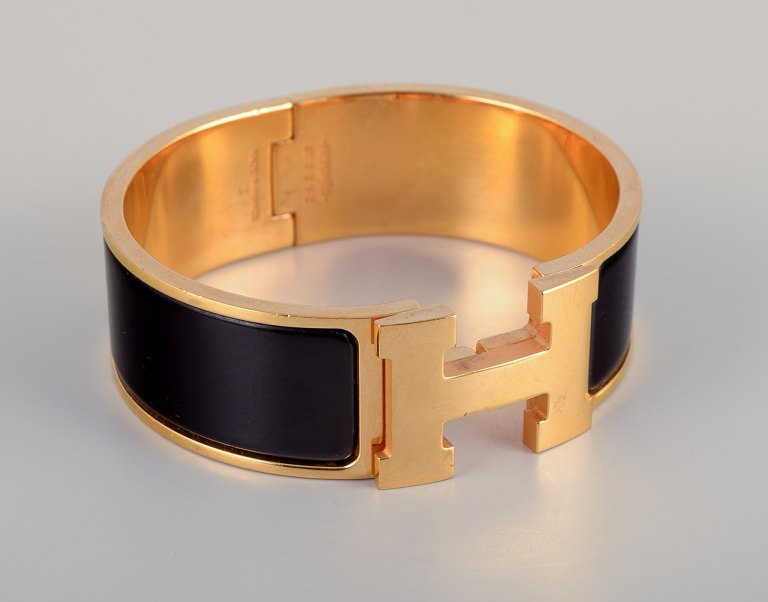 Hermes, France.Clic Clac H bracelet. Gold-plated metal and enamel.