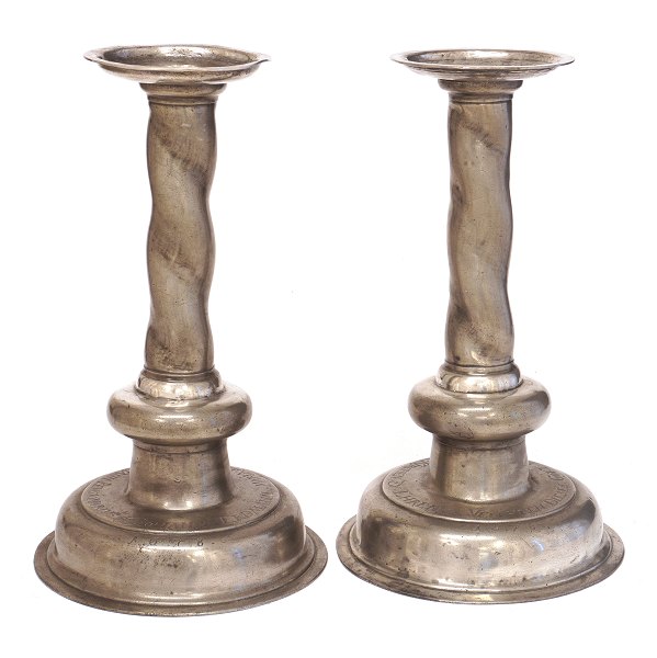 Pair of late 17th century pewter candelsticks dated 1678. "Johann Erdmann Maria Helenea Nevmann Pensionarivs". H: 33cm. D base: 19cm