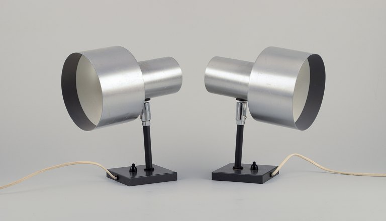 Fogh og Mørup, Danish lamp designer.A pair of wall lamps in aluminum and metal.