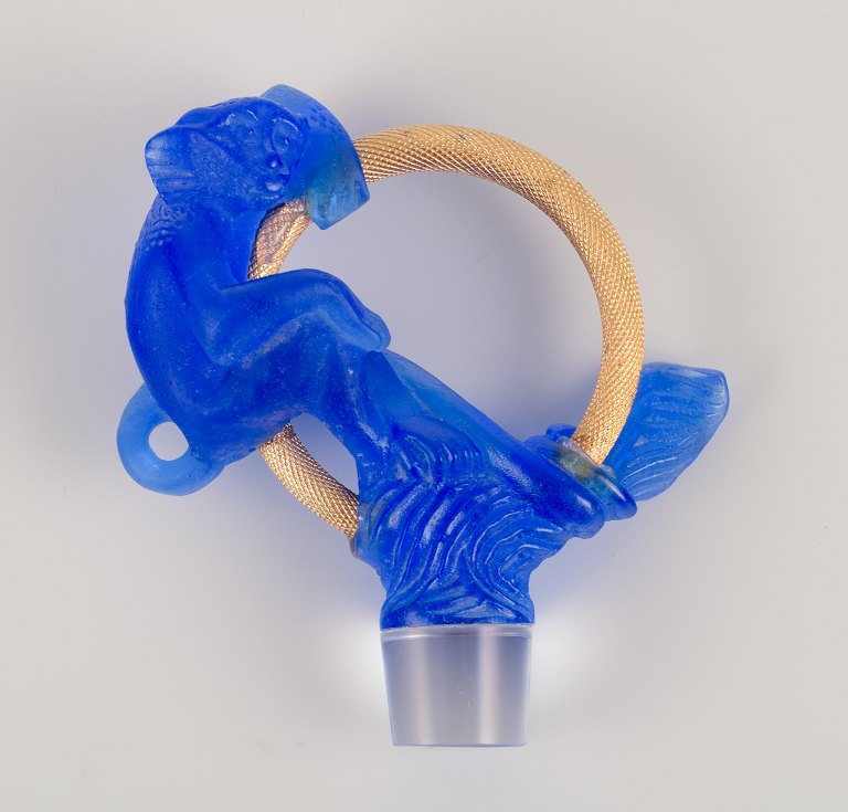 Daum, Nancy, France.Decanter stopper in art glass and gilded metal.