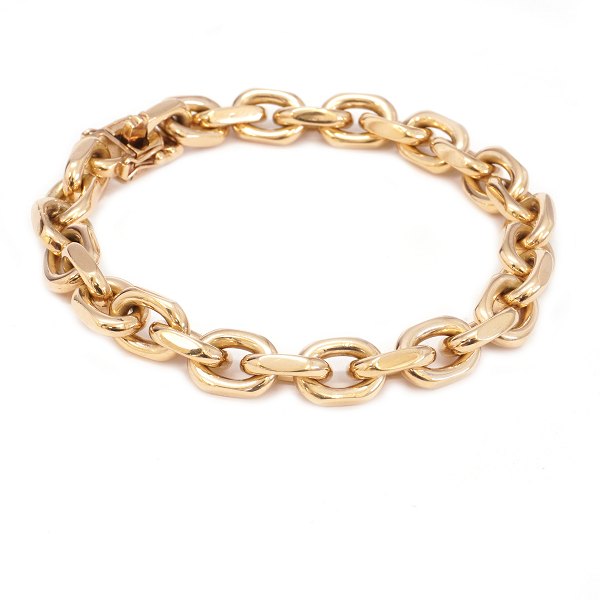 Anker armlænke i 14kt guld med facetterede led, kasselås og dobbelt sikkerhedslås af Bræmer-Jensen, Randers. Ledstr. 12x8mm. L: 19,5cm. V: 51gr