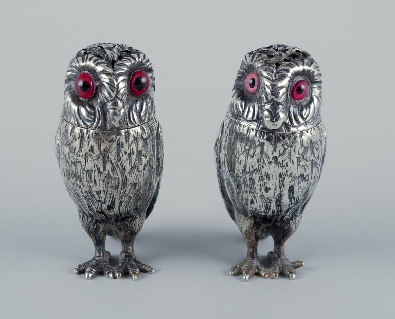Edward Charles BrownRare set of salt and pepper shakers shaped like owls with inserted red glass eyes.