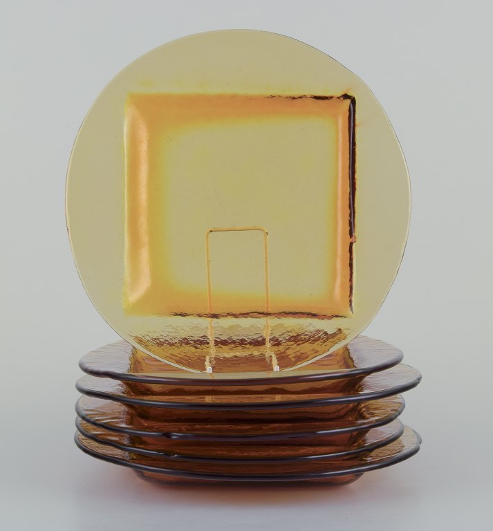 Scandinavian glass designer. A set of six dinner plates in smoke-coloured art glass.